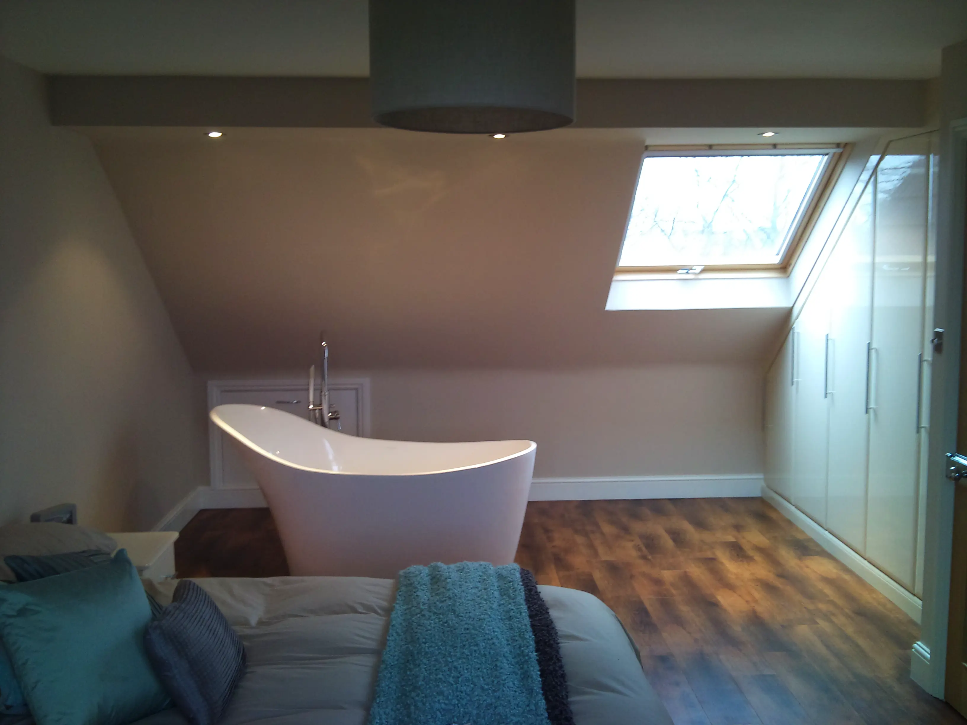 Guest bedroom with bathtub