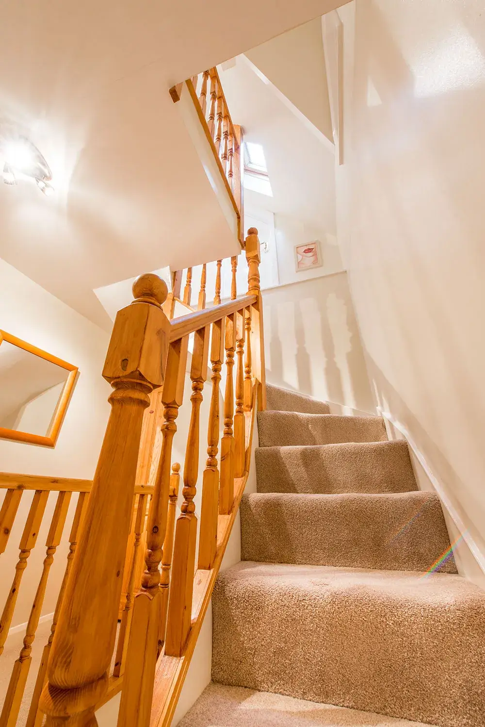 Staircase leading up to dormer attic conversion